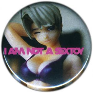 <b>Badge 5</b> - (I am not a sextoy), diamètre: 3,2 cm, édition: 50, 2008