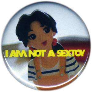 <b>Badge 6</b> - (I am not a sextoy), diamètre: 3,2 cm, édition: 50, 2008